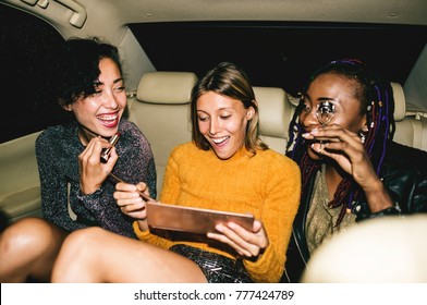 Diverse Women In A Backseat Of A Cab