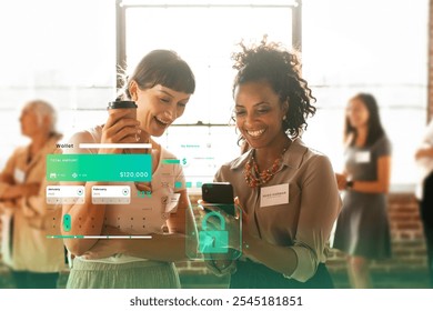 Diverse women, Caucasian and African American, smiling and looking at a smartphone. The women in a tech discussion with mobile and tech innovations. Digital wallet, cyber security in modern graphic. - Powered by Shutterstock