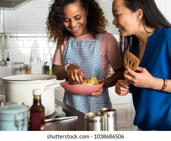 Diverse Women Cooking In The Kitchen Together