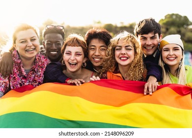 Diverse young friends celebrating gay pride festival - LGBTQ community concept 