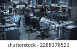 Diverse Young Indian Colleagues Working on Computers in a Research Laboratory. Focus on Female Software Developer Colleague Working on a Solution for Their Collaborative Industrial Tech Project