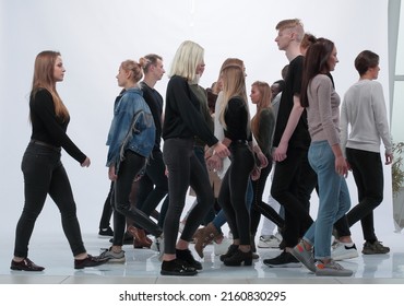 Diverse Young People Walking In Different Directions.