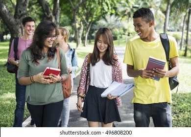 Diverse Young Students Book Outdoors Concept