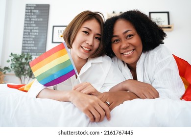 Diversity African American and Asian Married couples Lesbian LGBTQ. Married homosexual show Diamond ring.Sexual equality,LGBT Pride month,Parade celebrations concept.Family of happiness smiling.