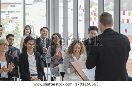 Diversity business audience group smiles and happy listening to male speaker giving a speech in corporate seminar event at conference room. ストックフォト © 