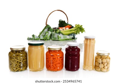 Diversity of canned vegetables in jars versus fresh vegetables. Focus on canned vegetables. Studio shot. White background.
 - Powered by Shutterstock