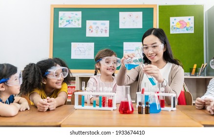 Diversity children doing a chemical experiment in laboratory at school. Portrait of happy kids at elementary school learning science chemistry with asian teacher. Fun study back to school concept. - Powered by Shutterstock