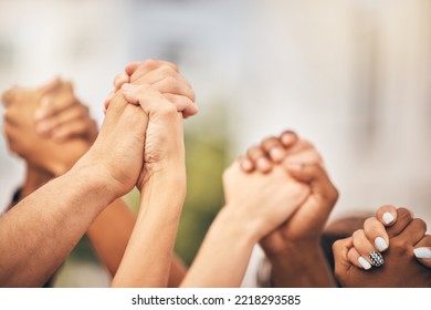 Diversity, community collaboration and holding hands in air strong together or racial empowerment march. Peace protest, trust teamwork and friendship help or friends, group or support human rights - Shutterstock ID 2218293585