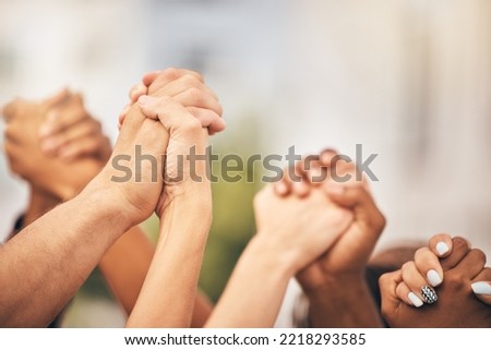 Diversity, community collaboration and holding hands in air strong together or racial empowerment march. Peace protest, trust teamwork and friendship help or friends, group or support human rights