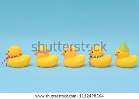 Diversity concept, Difference rubber ducks manage to line up.
