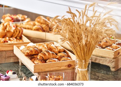 A diversity of fresh pastry, crispy morning croissants, hotel breakfast buffet isolated
