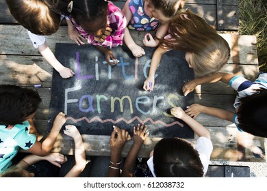 Diversity Group Of Kids Drawing Chalk Board