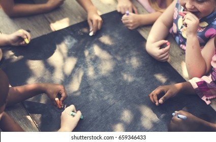 Diversity Group Of Kids Drawing Chalk Board