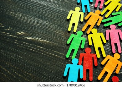 Diversity And Inclusion Background On The Dark Wooden Desk With Free Space.