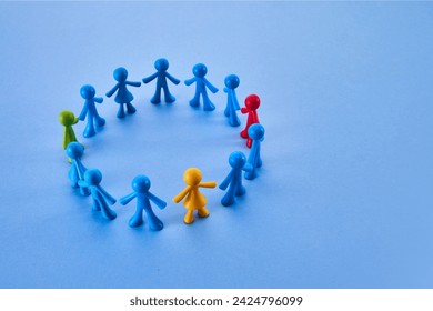 Diversity and inclusion concept. Colorful figurines on blue background - Powered by Shutterstock