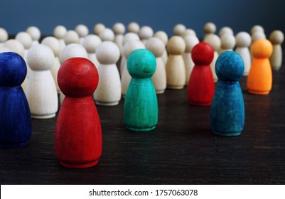 Diversity and inclusion concept. Crowd of wooden figures and color figures.