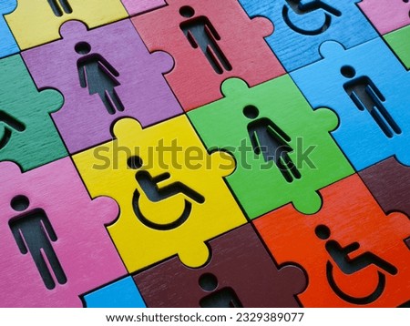 Diversity and inclusion. Multi colored puzzle with figures of people.