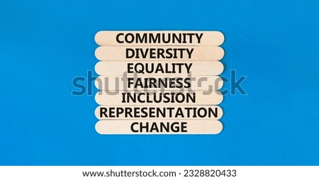 Diversity inclusion symbol. Concept words Community Diversity Equality Fairness Inclusion Representation Change on wooden stick on a beautiful blue background. Diversity equality inclusion concept.