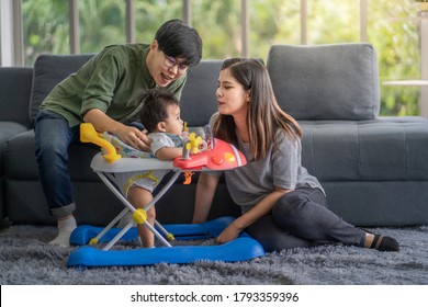 Diversity Lesbian Sitting With Cute  Toddler Girl In Between. Happiness And Family Bonding In LGBTQ Family, LGBT Lifestyle.