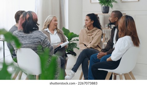 Diversity, mental health and group therapy counseling support meeting, healthy conversation and wellness. Psychology counselor, psychologist help people and talk about anxiety, depression or stress - Powered by Shutterstock