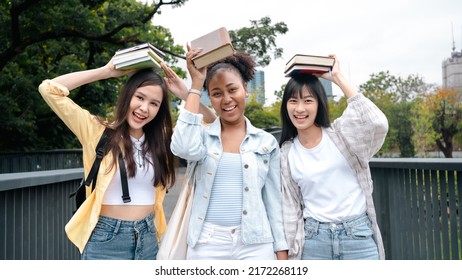 Diversity Multi Ethnic Woman Student Holding Books And Looking At Natural Outdoors At Park. Prepare For College And University Concept.Informal National Education .looking For Scholarship Opportunity.