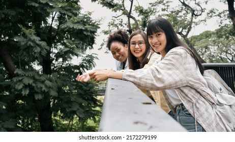 Diversity Multi Ethnic Woman Student Holding Books And Looking At Natural Outdoors At Park. Prepare For College And University Concept.Informal National Education .looking For Scholarship Opportunity.