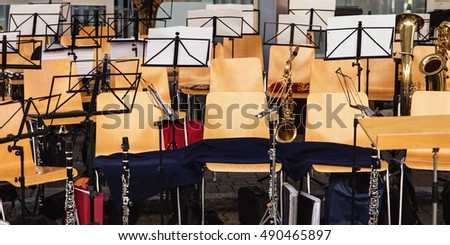diversity music instruments, music stands and chairs, traditional music society