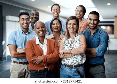 Diversity, portrait of happy colleagues and smile together in a office at their workplace. Team or collaboration, corporate workforce and excited or cheerful group of coworker faces, smiling at work - Shutterstock ID 2312975421