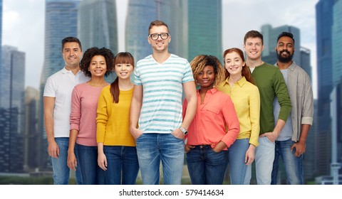 diversity, race, ethnicity and people concept - international group of happy smiling men and women over singapore city skyscrapers background - Shutterstock ID 579414634