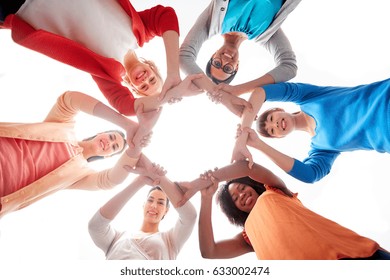 Diversity, Race, Ethnicity And People Concept - International Group Of Happy Smiling Different Women Over White Holding Hands Together