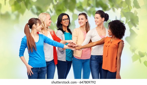 Diversity, Race, Ethnicity And People Concept - International Group Of Happy Smiling Different Women Holding Hands Together Over Green Natural Background