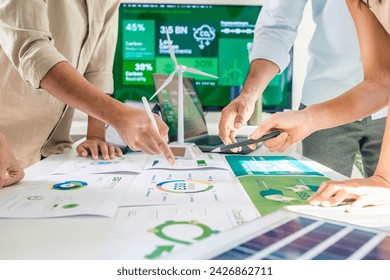 diversity team discussion focused on ESG (environment,social,governance)  for net zero goals in a sustainable green office - Powered by Shutterstock