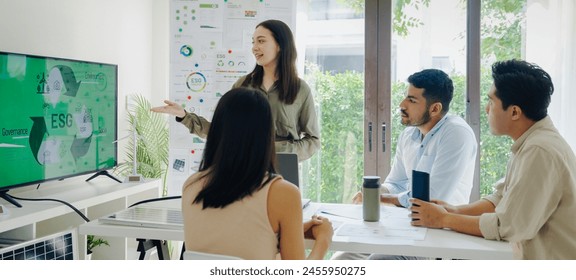 diversity team presentation  in ESG (environment,socail,governance)  sustainability business goals sdgs in green office - Powered by Shutterstock