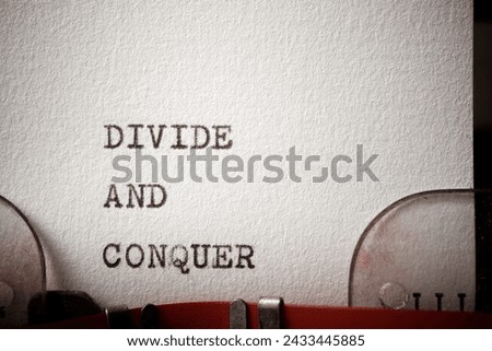 Divide and conquer text written with a typewriter.