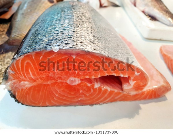 Divided\
fish, raw red fish prepared for cooking,\
seafood.
