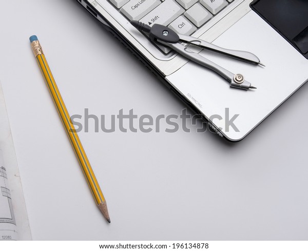 Dividers, a draft and a white\
laptop