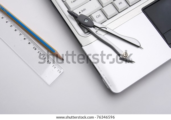 Dividers, a draft and a white\
laptop