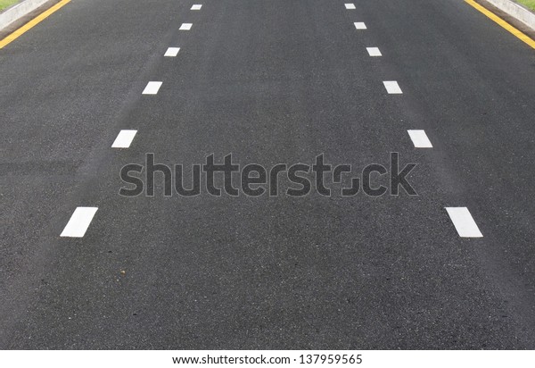 Dividing line on surface\
road