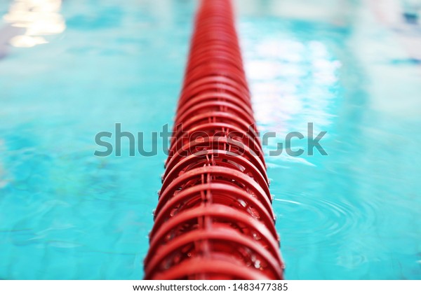 Dividing the\
red buoy in the pool with clean\
water