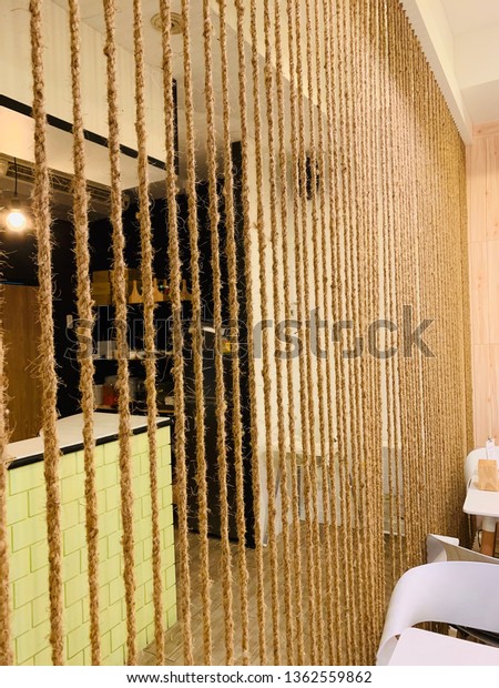 Dividing the room area by using\
multiple ropes to stretch . This walls into beautiful, chic\
room.