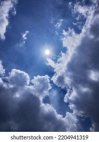 Divine White Clouds Float In The Afternoon Sky