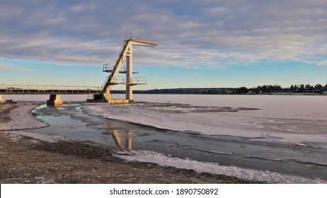 Diving Board Over A Freezing Fjord In Norway