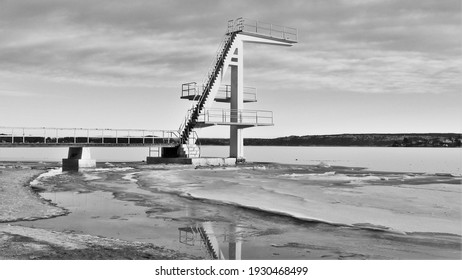 Diving Board Over A Freezing Fjord In Norway