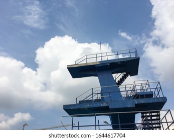 A Diving Board In A Public Swimming Pool.
