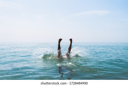 diving into the sea water backflip swandive cliff dive