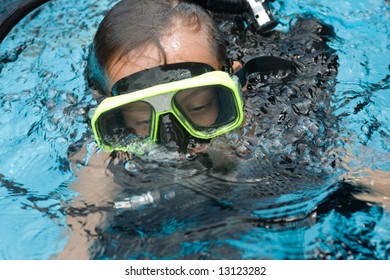 Diving lesson with an instructor in a pool and open sea, teaching underwater skills, safety and recreation.