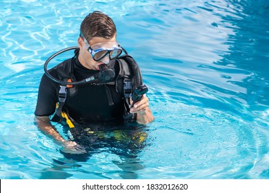 Diving Pool Workout: A Man In Diving Gear Trains.