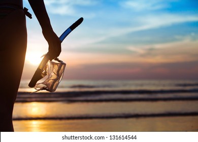 Diving, Silhouette Of Hand With Equipment For Snorkeling, On The Beach