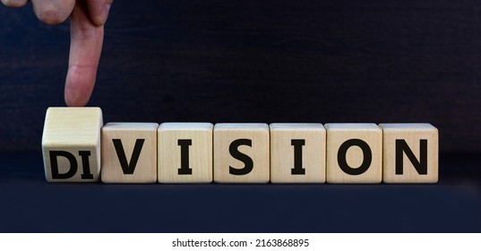 Division Or Vision Symbol. Turned Cubes And Changed The Concept Word Division To Vision. Businessman Hand. Beautiful Grey Table Grey Background. Business Division Or Vision Concept. Copy Space.