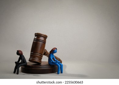 Divorce concept. Plasticine people figures and wooden gavel on light grey background, space for text - Shutterstock ID 2255630663